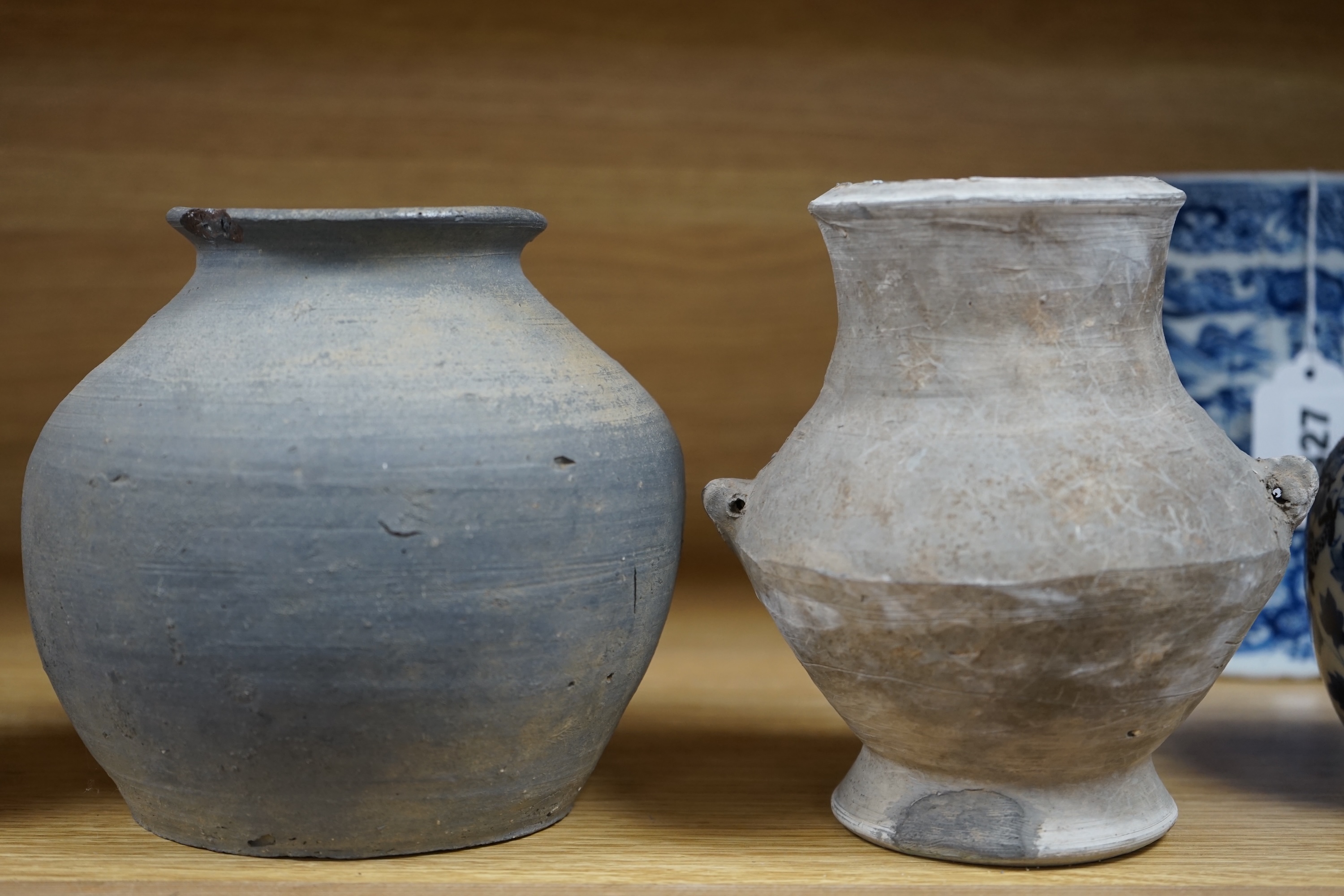 Four Chinese archaic pottery vessels, Neolithic to Han Dynasty, largest 16cm high. Condition - fair, antique condition